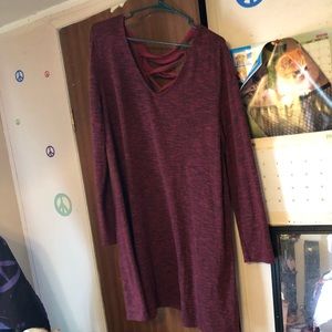 A long sleeve maroon dress
